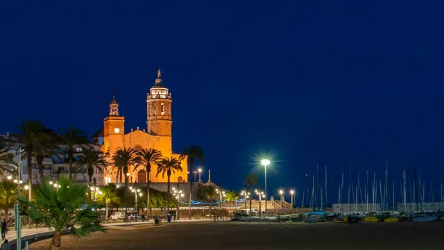 Sitges church above the seafront at night